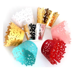 Laser cut floral cupcake wrappers in various metallic and matte colors for party decor