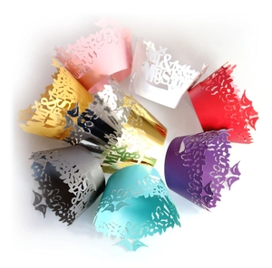 Laser cut Mr & Mrs cupcake wrappers in various colors for wedding table decorations