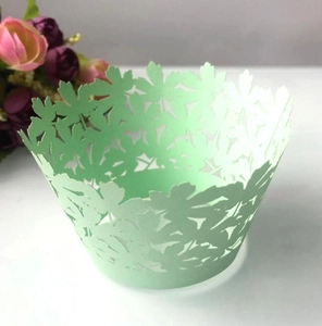 Laser-cut cupcake wrappers with leaf patterns for wedding party decorations in mint green