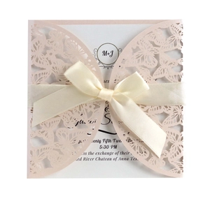 Pink laser-cut butterfly wedding invitation set with elegant cream ribbon and inner card