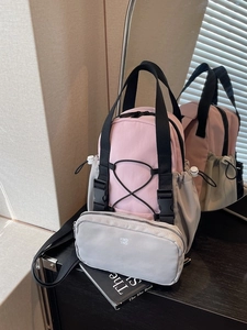 Pink and grey mini backpack for women featuring a functional outdoor aesthetic design