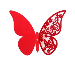 Detail of red hollow laser-cut butterfly decoration for party and home wall decor