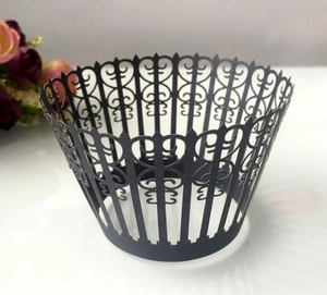 Detailed laser-cut black lace cupcake wrappers with elegant European floral fence pattern