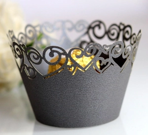 Elegant laser-cut heart pattern cupcake wrappers in charcoal gray with pearlescent finish