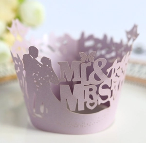 Detailed laser cut Mr & Mrs cupcake wrapper in pink for romantic wedding table decoration