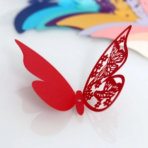 Laser-cut red butterfly paper card with intricate floral patterns for wedding decoration