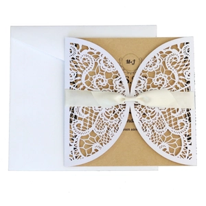 Elegant laser cut lace wedding invitation set with kraft paper card and white silk ribbon