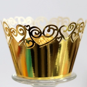 Golden heart laser cut cupcake wrapper with reflective metallic finish for parties