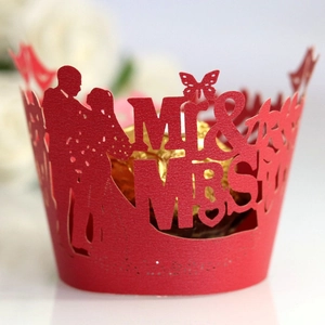Pink laser-cut cupcake wrappers with Mr & Mrs silhouette and butterflies for weddings