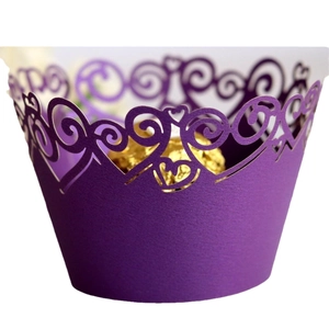 Deep purple laser-cut cupcake liners with heart patterns and gold chocolate filling