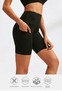 Close-up of high-waist yoga shorts in black with functional side pockets and flat seams