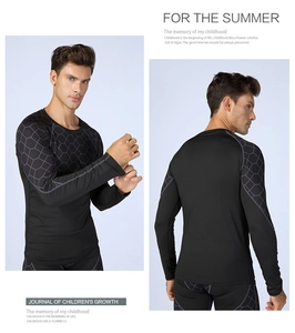 Close-up of men's compression shirt with gray hexagonal honeycomb texture patterns