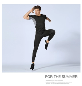 Close-up of men's compression set showing stretchy quick-dry fabric and muscle-fit design
