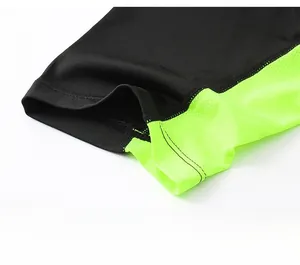 Close-up of black and lime green breathable mesh sleeve cuff on compression sports shirt