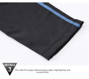 Close-up of black athletic compression sleeve featuring blue reinforced flatlock stitching