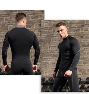 Detail of men's compression sports set featuring grey stitching and quick-dry fabric