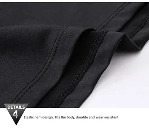 Close-up of double-stitched elastic hem on men's black quick-dry compression gym shirt