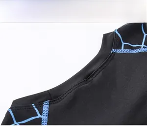 Detail showing the flatlock stitching and breathable fabric of the men's fitness top