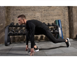 Action shot of men's compression long sleeve top and pants set for gym fitness training