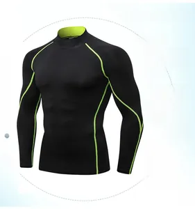 Close-up of black sports compression shirt featuring neon green contrast stitching details