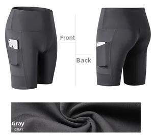 Detail view of high-waisted gray yoga shorts with side pockets and fabric texture