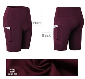 Detailed view of high waist yoga shorts in wine red with functional side pockets