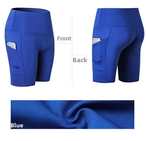 Detail view of high-waisted blue yoga shorts featuring side phone pockets and knit fabric
