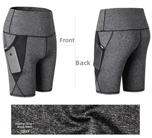 Viste dettagliate degli shorts da yoga grigi a vita alta con tasca laterale e cuciture nere