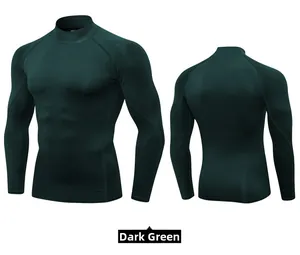 Detail view of men's dark green mock neck compression shirt with ergonomic seams