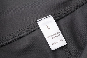 Close-up of fabric tag for high waist yoga shorts showing 90% polyester 10% spandex blend