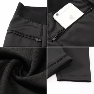 Dettaglio dei leggings sportivi da uomo con tasca laterale a zip per lo smartphone