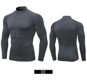 Detail view showing front and back of dark gray compression gym shirt with seamless stitching