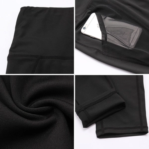 Detailed view of high-waist black yoga leggings featuring mesh side pockets and reinforced seams
