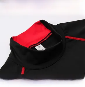 Macro detail of men's turtleneck sports shirt with red stitching and moisture-wicking fabric