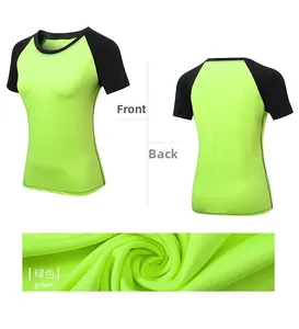 Detail view of quick-dry neon green yoga shirt featuring black raglan sleeves and textures
