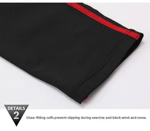 Detail of men's athletic cuff with red flatlock stitching on black compression fabric