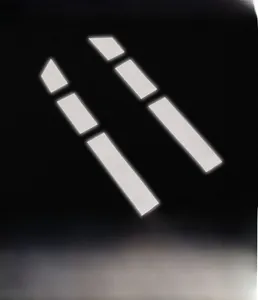 Detail view of high-visibility reflective strips on black athletic compression shirt