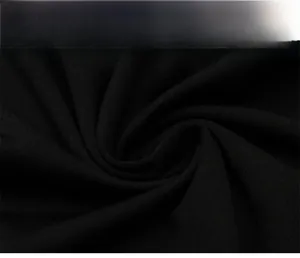 Close-up of black men's athletic fabric showing breathable knit texture and soft elasticity
