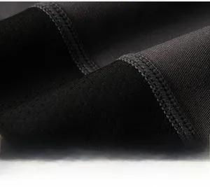 Macro view of mesh breathable fabric and flatlock stitching on men's sports tights