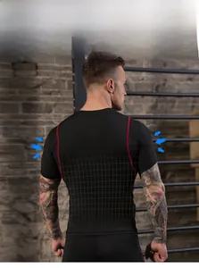Detail of men's compression shirt with red stitching and breathable mesh back panel
