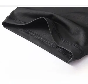 Close-up of tight stitching and high-elastic quick-dry fabric on men's compression shirt