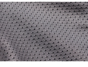 Close-up of grey breathable mesh fabric with honeycomb structure and raised dots