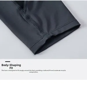 Macro detail of men's compression leggings showing flatlock stitching and elastic cuff fabric