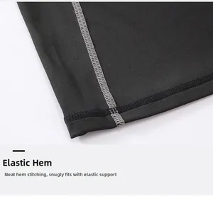 Close-up of black sports T-shirt with reinforced elastic hem and grey flatlock stitching