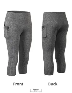Vista dettagliata fronte e retro dei pinocchietti yoga grigi a vita alta con tasche