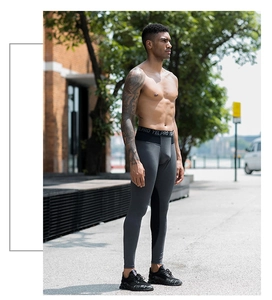 Detail of men's PRO compression leggings with elastic waistband and mesh paneling