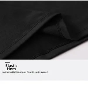 Detail shot of the elastic hem with double-needle stitching on black men's fitness t-shirt