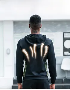 Detail showing windproof camouflage hoodie with thermal technology and orange heat map