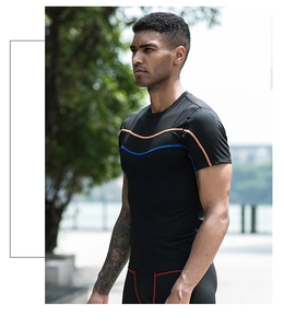 Detail of men's quick-dry compression t-shirt featuring vibrant blue and orange stitching