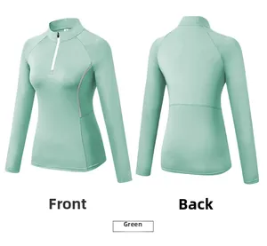 Front and back views of women's mint green half-zip sports top with slim fit design